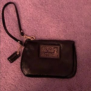 Black and gold Coach wristlet